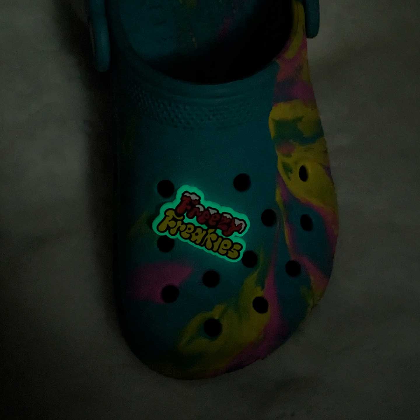 Freezy Freakies shoe charm on clog glowing in the dark