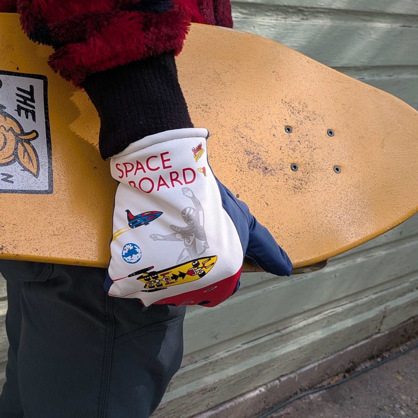 Space Board Freezy Freakies holding yellow skateboard