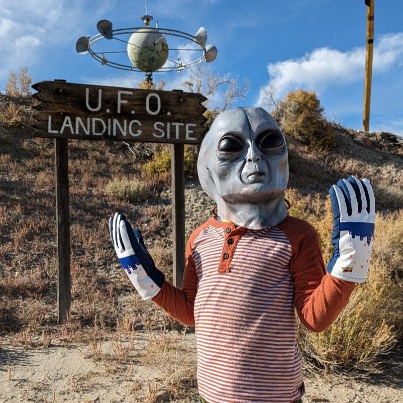 Alien wearing UFO Freezy Freakies at his landing site