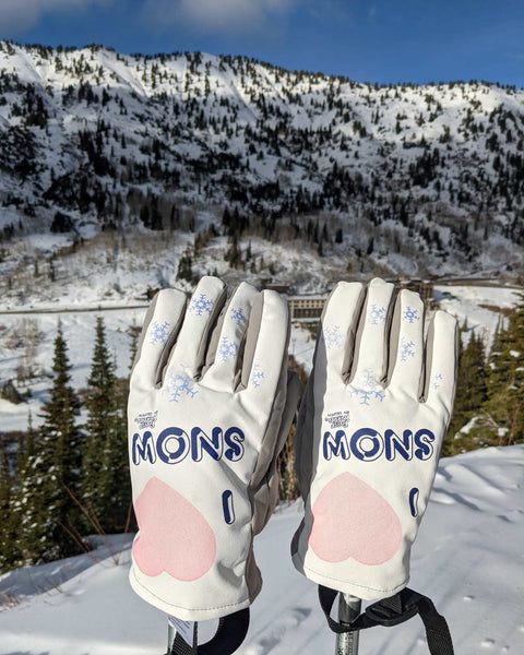 I Love Snow Freezy Freakies gloves perched on a mountaintop