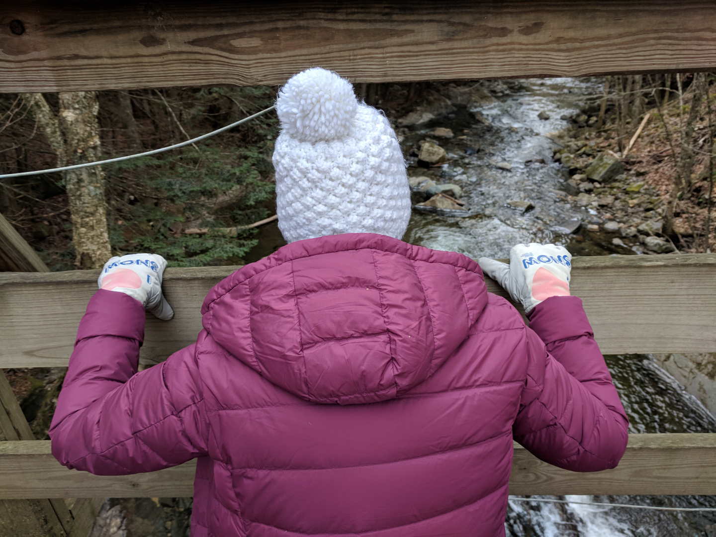 Lady in I Love Snow Freezy Freakies gloves saying goodbye to all the melted snow